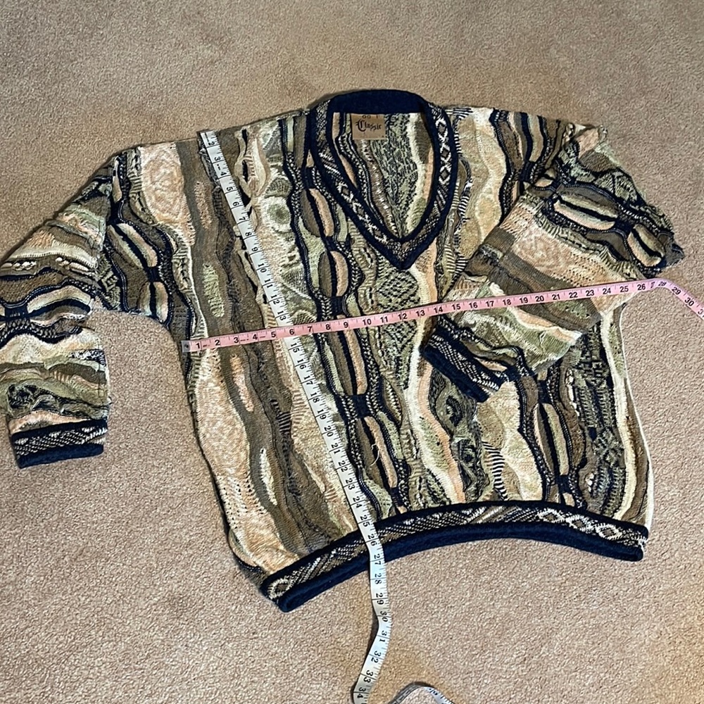 COOGI XL multi colored sweater. Hardly worn just a couple pulls easy fix!